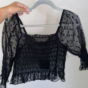 These three boutique mesh star top